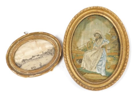 An 18thC silk work picture of a lady, modelled seated by a spinning wheel in a garden setting, a cat at her feet, oval gilt wood framed, 23cm x 16cm, together with a further monochrome silk work picture of a country house, with horses to the fore, gilt wo