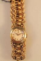 An Omega ladies 18ct gold fancy bracelet wrist watch