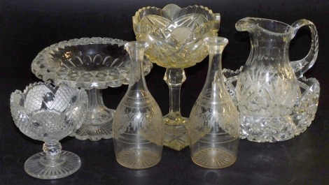 A group of Victorian and later cut glassware, including a pair of decanters, pedestal sweetmeat dishes, cut glass water jug and a fruit bowl. (a quantity)