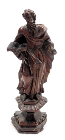 An 18thC Venetian carved wooden figure of a saint, carved standing holding a book in his right hand, raised on a plinth base, 30.5cm high.