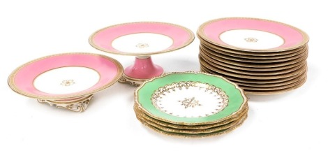 A late 19thC Staffordshire porcelain part dessert service, pink ground, with a gilt floral border, comprising a comport, tazza and twelve dessert plates, together with four apple green porcelain dessert plates, gilt heightened.