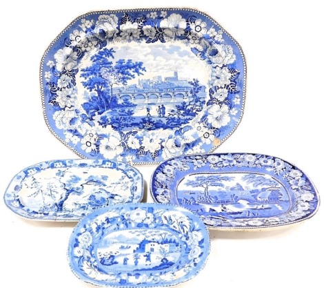 Four early 19thC blue and white meat platters, comprising a Elkin Knight and Company platter decorated with a view of Lancaster, Wild Rose pattern meat plate, Rural Scenery pattern platter with cattle, within a floral border, and a Chinese Flowering Pot p