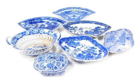 A group of early 19thC blue and white pottery dessert wares, including a chestnut basket decorated in the Grazing Rabbits pattern, Spode Castle pattern dessert dish, Willow pattern dessert dish, Spode Net pattern supper segment, two further supper segment