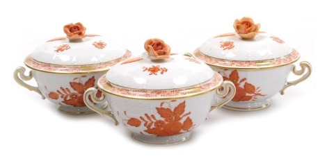 Three Herend porcelain Chinese Bouquet rust ecuelles and covers, with rose finials, printed marks.