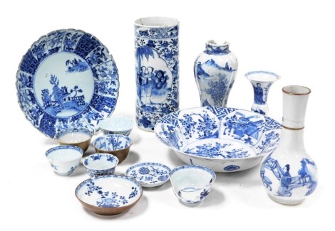 A group of Qing Dynasty blue and white Chinese porcelain, 18thC onwards, including tea bowls and saucers, a cylindrical vase decorated with reserves of figures in a garden, Kangxi porcelain bottle vase, Batavian tea bowls and a saucer, etc. (a quantity)