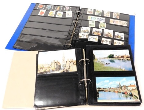 Deltiology and Philately. Boston, Lincolnshire and other topographical postcards, together with an album of QEII mint commemorative stamp sets. (2)