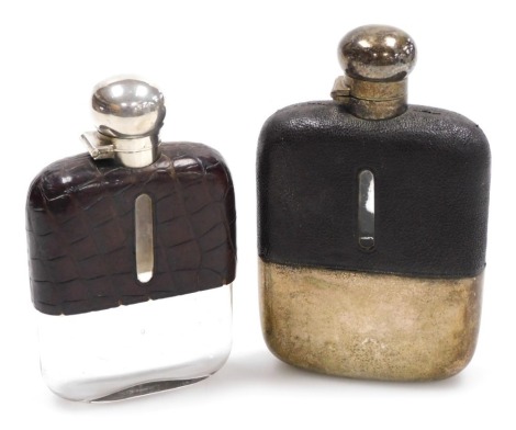 A George V cut glass silver and skin bound hip flask, lacking stopper, James Dixon & Sons Ltd Sheffield 1921, together with a silver plate and leather bound glass hip flask. (2)