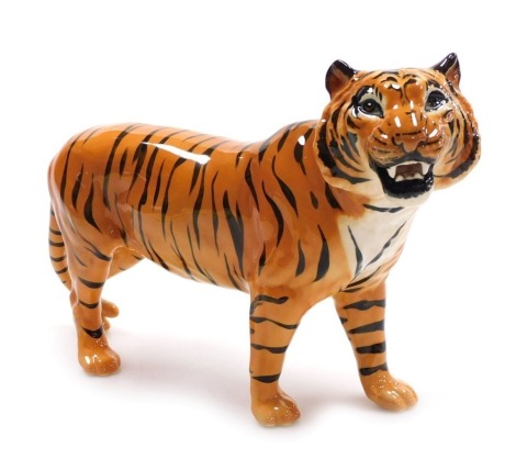 A Beswick figure of a tiger, 15cm high, 15cm long.