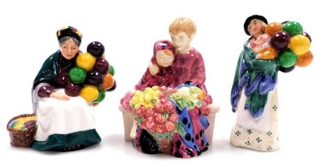 Three Royal Doulton figures, comprising Flower Seller's Children, HN4807, The Old Balloon Seller, HN2129 (unboxed), and The Balloon Seller, HN2130, two boxed.