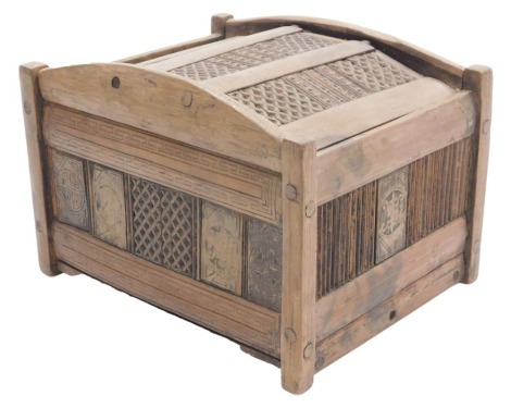 A Chinese bamboo box, with hinged lid and hand worked carved panels, with lattice and roundel decoration, 15cm high, 22cm wide, 17cm deep.