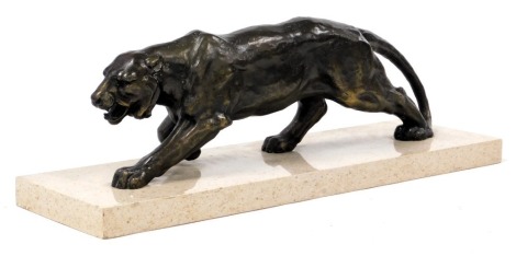 A Continental Art Deco bronzed metal figure of a panther, raised on a terrazzo marble base, 55cm high.