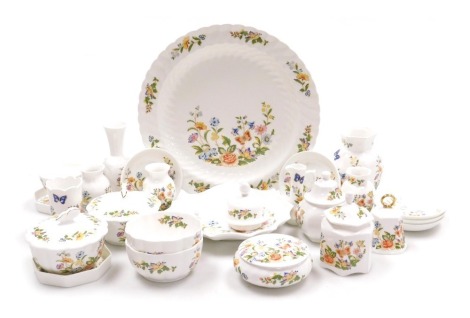 A group of Aynsley Cottage Garden pattern porcelain, including vases, dishes, boxes and covers, a bell, circular platter, some boxed. (a quantity)