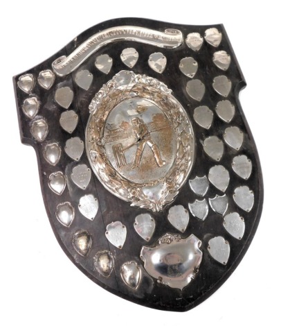 The Lincolnshire Constabulary Cricket Challenge Shield, silver plated on oak shield mount, with individual shields showing the winners from 1931-1982, 61cm x 47cm.