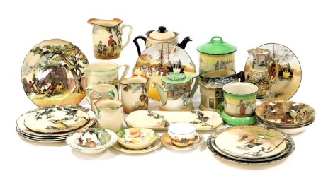 A group of Royal Doulton series ware pottery and porcelain, including Sir Roger Coverley, Under The Greenwood Tree, Charles Dickens, coaching scenes, to include teapots, milk jugs, biscuit barrel, plates and bowls. (a quantity)