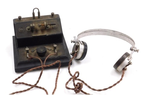 An early 20thC vintage BBC crystal radio set, with a pair of SG Brown of London type F2000 speaker headphones.