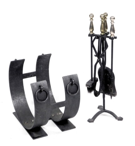 A cast iron fire basket stand, 35cm wide, and a cast iron and brass handled five piece fireside companion set. (2)