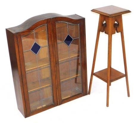 An early 20thC oak cabinet top, with two glazed doors, 95cm high, 74cm wide, 19cm deep, together with a Victorian Art Nouveau mahogany jardiniere stand, with a square top raised on tapering square legs, united by an undertier, 97cm high, 27.5cm wide, 27.5