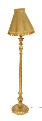 A Victorian gilt wood standard lamp, of carved and fluted form, with shade, 172cm high.