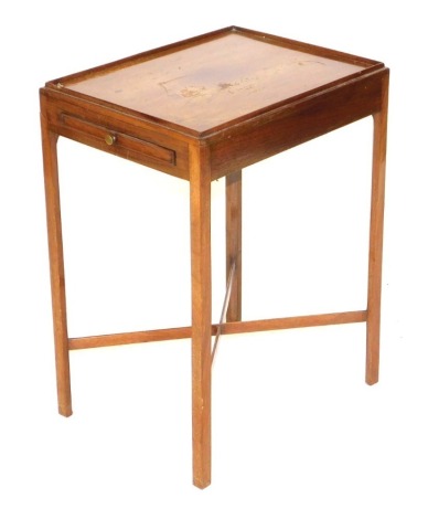 An Edwardian mahogany urn or night table, with single frieze drawer, raised on canted square legs united by a X frame stretcher, 62cm high, 35cm wide, 45cm deep.