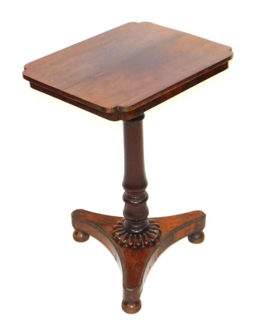 A Regency rosewood occasional table, with a shaped rectangular top, raised on a turned column above a trefoil base, on bun feet, 72cm high, 51cm wide, 40cm deep.