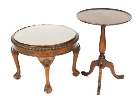 A late Georgian mahogany occasional table, with a circular top raised on a turned column over three cabriole legs, 63cm high, 46cm diameter, together with an early 20thC walnut circular occasional table, inset glass to the top, raised on four shell capped