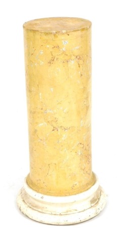 A circular yellow faux marble column, raised on a white painted base, 86cm high.