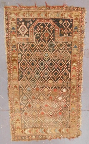 A Persian black ground prayer rug, the mihrab filled with stylised flowers, within repeating floral and geometric borders, 168cm x 88cm. (AF)