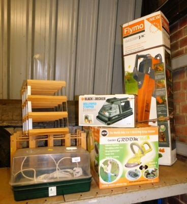 A garden groom midi, a Black & Decker wallpaper stripper, Flymo garden vac, two wine racks and a propagator.   Buyer Note: WARNING! This lot contains untested or unsafe electrical items. It is supplied for scrap or reconditioning only. TRADE ONLY