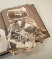 A postcard album including WWI postcards and other topographical postcards and a Royal Children's sn