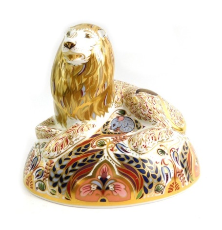 A Royal Crown Derby porcelain paperweight modelled as Lion, gold stopper and red printed marks, 14cm high.