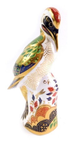 A Royal Crown Derby porcelain paperweight modelled as Green Woodpecker, gold stopper and red printed marks, 17cm high.