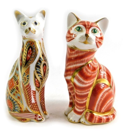 A Royal Crown Derby porcelain paperweight modelled as Siamese Cat, second, silver stopper and red printed marks, 13cm high, together with Ginger Cat, second, lacking stopper, red printed marks, 14cm high. (2)