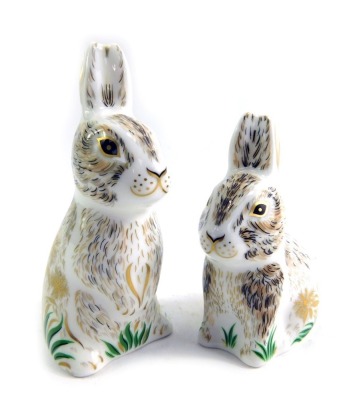 Two Royal Crown Derby porcelain rabbit paperweights, modelled as Dandelion, an exclusive for The Collectors Guild, gold stopper and red printed marks, 10cm high, and Nibbles, gold stopper and red printed marks, 8cm high, one boxed.