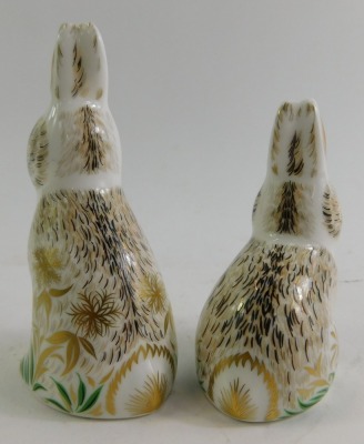 Two Royal Crown Derby porcelain rabbit paperweights, modelled as Dandelion, an exclusive for The Collectors Guild, gold stopper and red printed marks, 10cm high, and Nibbles, gold stopper and red printed marks, 8cm high, one boxed. - 2