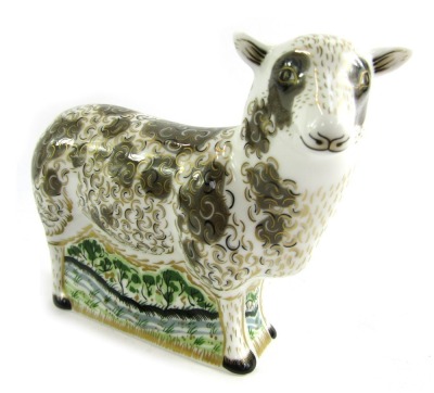 A Royal Crown Derby porcelain paperweight modelled as Jacob Sheep, gold stopper and red printed marks, 11cm high, boxed.