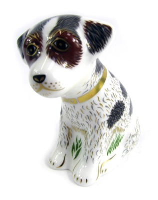 A Royal Crown Derby porcelain paperweight modelled as Sitting Puppy, gold stopper and red printed marks, 8cm high, boxed.