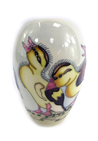 A Moorcroft Spring Ducklings vase, on a grey and blue mottled ground decorated with ducklings, signed to underside and dated 2014, 13cm high.