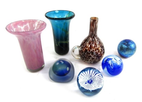 A collection of Art Glass, comprising a pink mottled Mdina vase with flared rim, 13cm high, a turquoise Mdina vase, signed 87, 14cm high, an Avondale glass mottled jug with single handle, 13cm high, and four Art Glass paperweights, to include Gozo and Cai