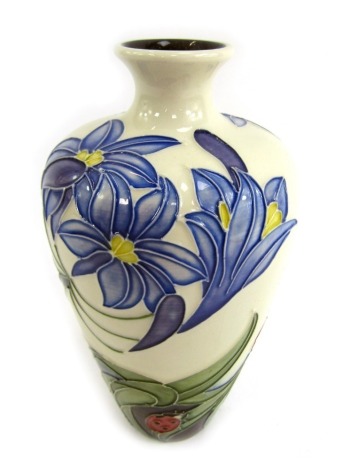 A Moorcroft Rachel Bishop Fly Away Home vase, on a cream ground, signed in gold and dated 2005, 16cm high.