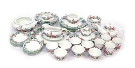 A Portmeirion part tea and dinner service decorated in the Summer Garland pattern, to include teacups, gravy boat and saucer, teapot, lidded sugar bowl, tureen lacking lid, dinner plates, etc.