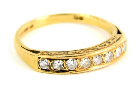 An 18ct gold half hoop diamond dress ring, set with eight round brilliant cut diamonds, each approx 0.05ct, ring size L½, 3g all in.