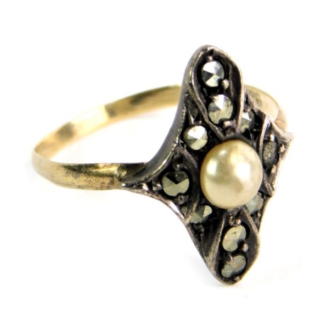 A marquise shaped dress ring, set with marcasite stones and central cultured pearl, in white gold setting on a yellow metal band, unmarked, ring size L½, 1.9g all in, boxed.