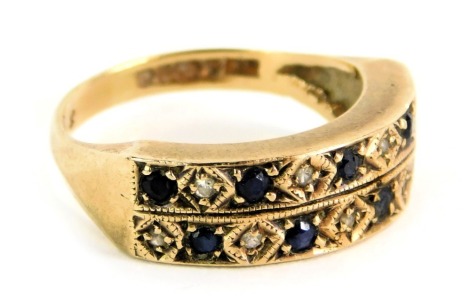 A half hoop dress ring, of two bar design, set with diamond and sapphire, yellow metal with rubbed hallmarks believed to be 18ct gold, ring size N½, 3.3g all in.