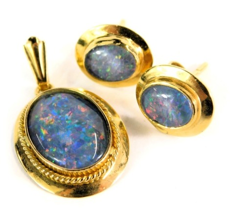 An opal set pendant and earring set, the blue and white backed imitation opal, in a yellow metal frame stamped 18ct, 5.7g all in.