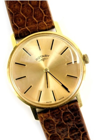 A Rotary gent's wristwatch, with a gold finish dial and stainless steel back, inscribed Presented to F E Sellers John Player and Sons 25 Years Service 1954-1979, on a brown crocodile skin effect strap, the dial 3.5cm diameter.