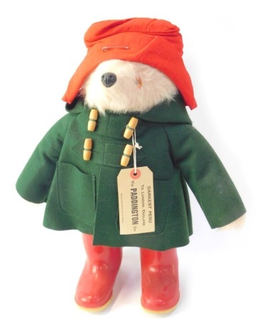 A Gabrielle Designs 1970s Paddington Bear, with green felt duffel coat and red Dunlop wellingtons, 47cm high.