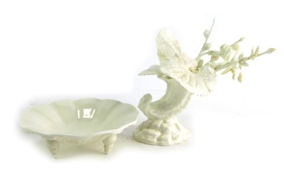 A Royal Worcester white porcelain dish, of circular form, raised on three shell shaped feet, green painted marks, numbered 180, 12cm high, a shell shaped bud vase, 8cm high, etc.