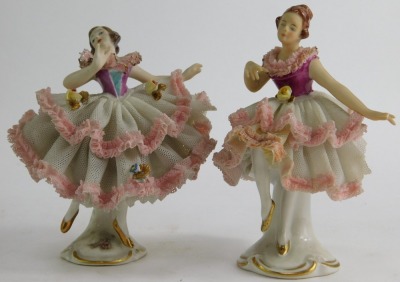 A group of 20thC Continental and other porcelain, to include Dresden crinoline figures, a pair of Capodimonte style figures, pair of Staffordshire cats, 19cm high, porcelain figures of classical ladies, etc. (1 tray). - 4