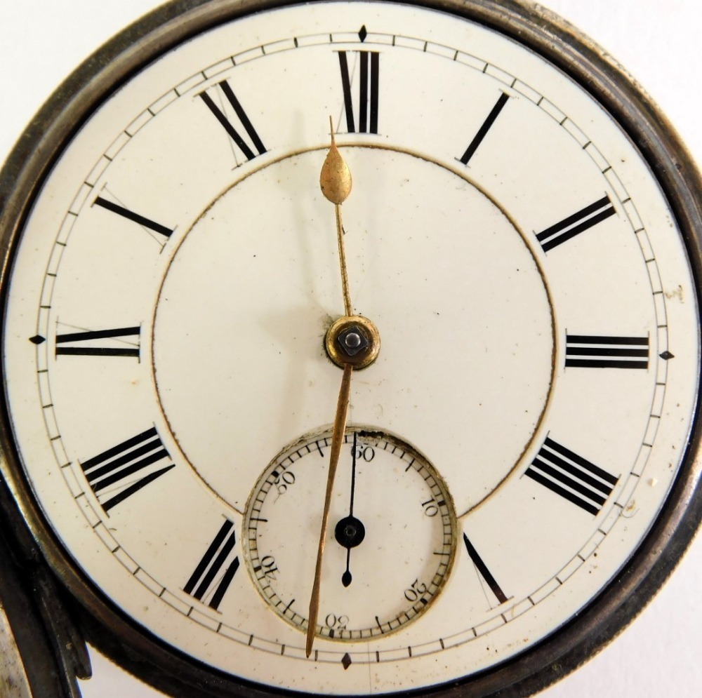 Numeric Watch A Victorian silver pocket watch, with white enamel Roman numeric dial ...