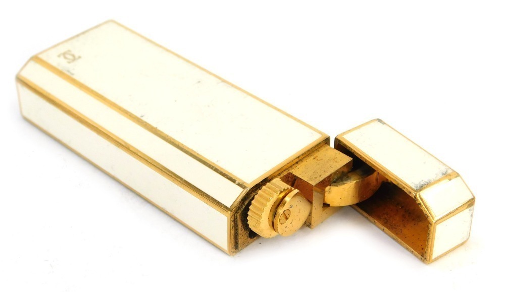 A Cartier of Paris enamel and gold plated cigarette lighter